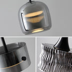 A collage of three close-up photos shows modern metallic pendant lights with glossy, reflective silver finishes. The lights have smooth, curved, and textured surfaces, highlighting their sleek, contemporary design.