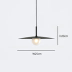 Minimalist pendant light with a wide, flat black shade and a round bulb underneath. Dimensions are labeled: height 20 cm and width 25 cm. The lamp hangs from a thin black cord.