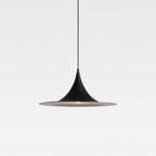 Minimalist black pendant light with a cone-shaped top and wide, flat bottom, suspended by a thin cord against a plain white background.