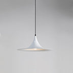 A modern, white pendant light with a sleek, cone-shaped shade hangs from a thin black cord against a plain gray background.