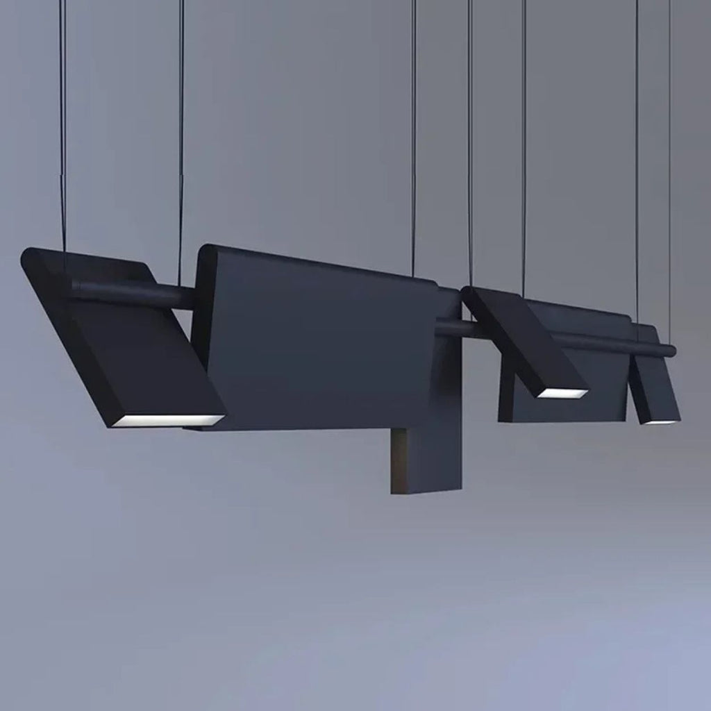 Modern, geometric pendant lights hang from the ceiling, featuring rectangular and angular shapes with integrated LED panels. These striking pendant lights cast light downward against a plain gray background.