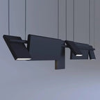 Modern, geometric pendant lights hang from the ceiling, featuring rectangular and angular shapes with integrated LED panels. These striking pendant lights cast light downward against a plain gray background.