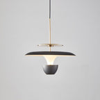 A modern luxury pendant light fixture with a black and gold finish, featuring a wide, flat shade and suspended from a black cord against a plain light gray background.