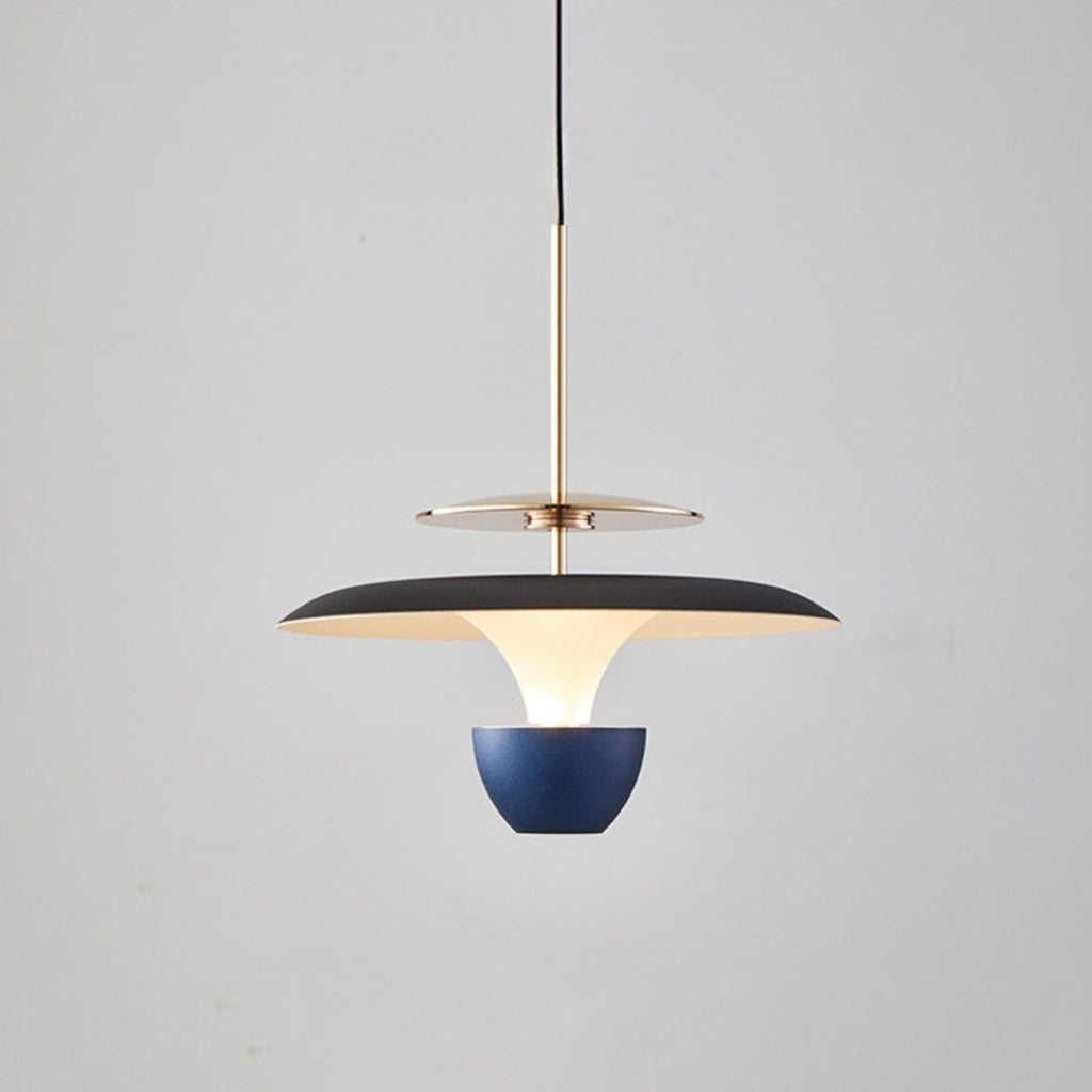 A modern pendant light luxury fixture featuring a black and gold circular shade, white inner diffuser, and blue bowl-shaped accent, elegantly suspended from a black cord against a plain light gray background.
