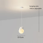 This pendant light features a glowing spherical shade with a small bear figure on top. With a 15cm diameter and an adjustable 100cm wire, it’s perfect for adding playful charm to any room.