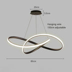 Modern LED pendant light with two intertwined oval rings, suspended by adjustable hanging wires from a round ceiling mount; this elegant pendant light measures 80cm wide, 20cm from ceiling base, and has a 3.5cm mount depth.